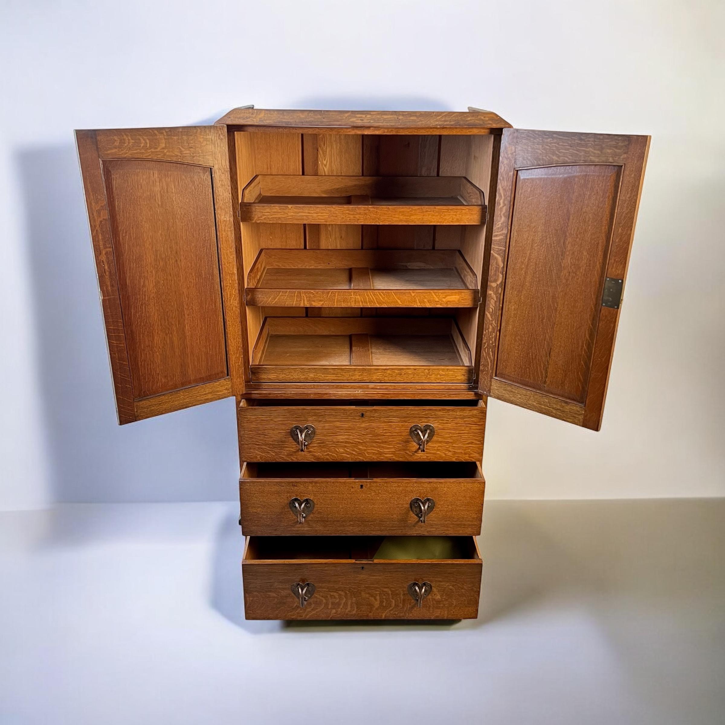 English An Arts & Crafts Oak Linen Press In The Manner Of Liberty London For Sale