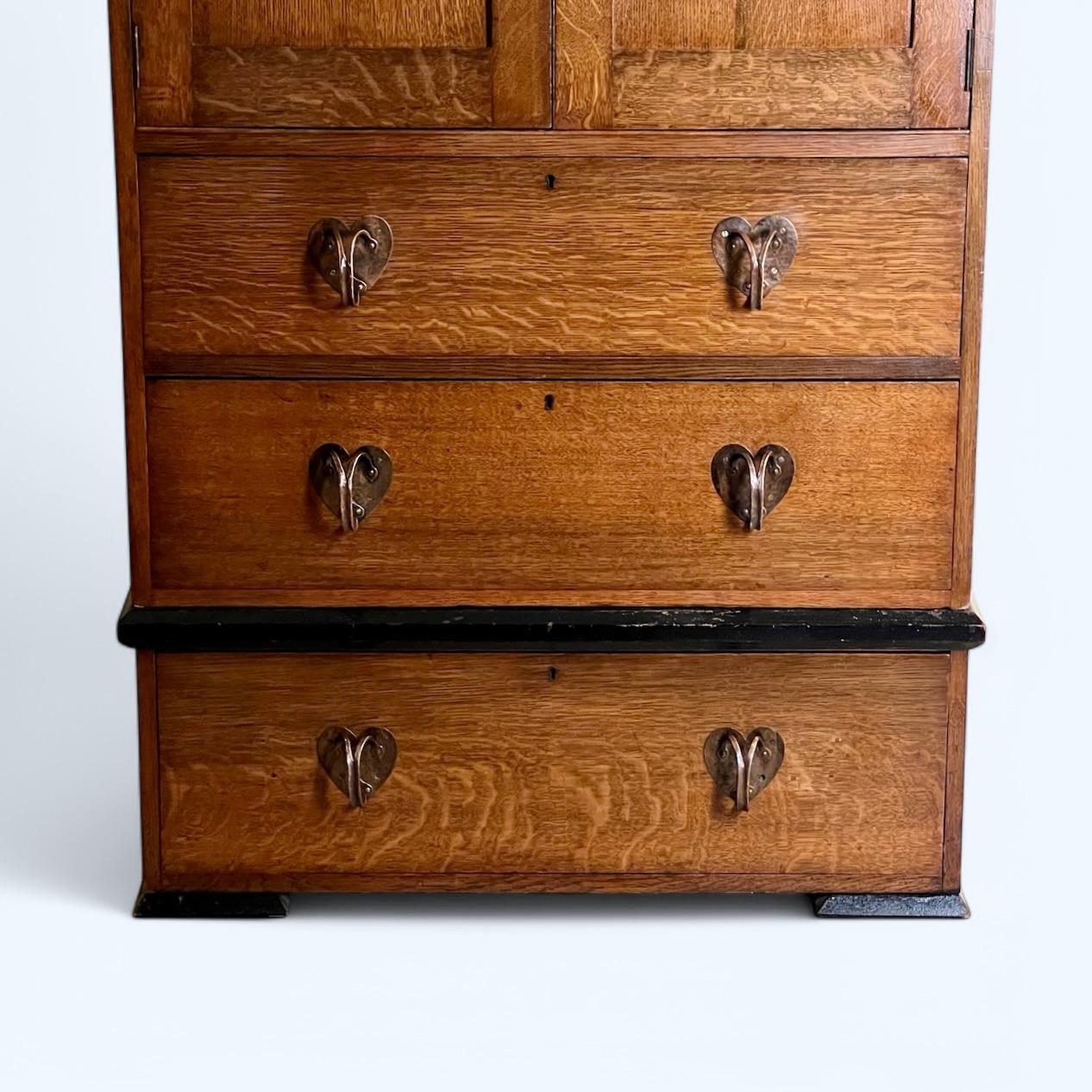20th Century An Arts & Crafts Oak Linen Press In The Manner Of Liberty London For Sale