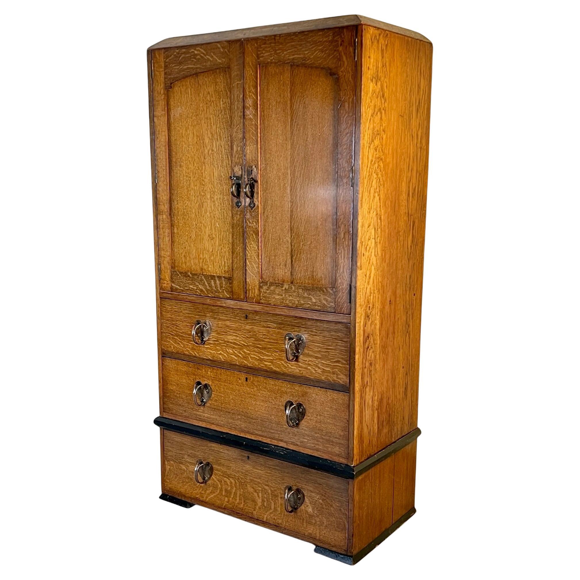 An Arts & Crafts Oak Linen Press In The Manner Of Liberty London For Sale
