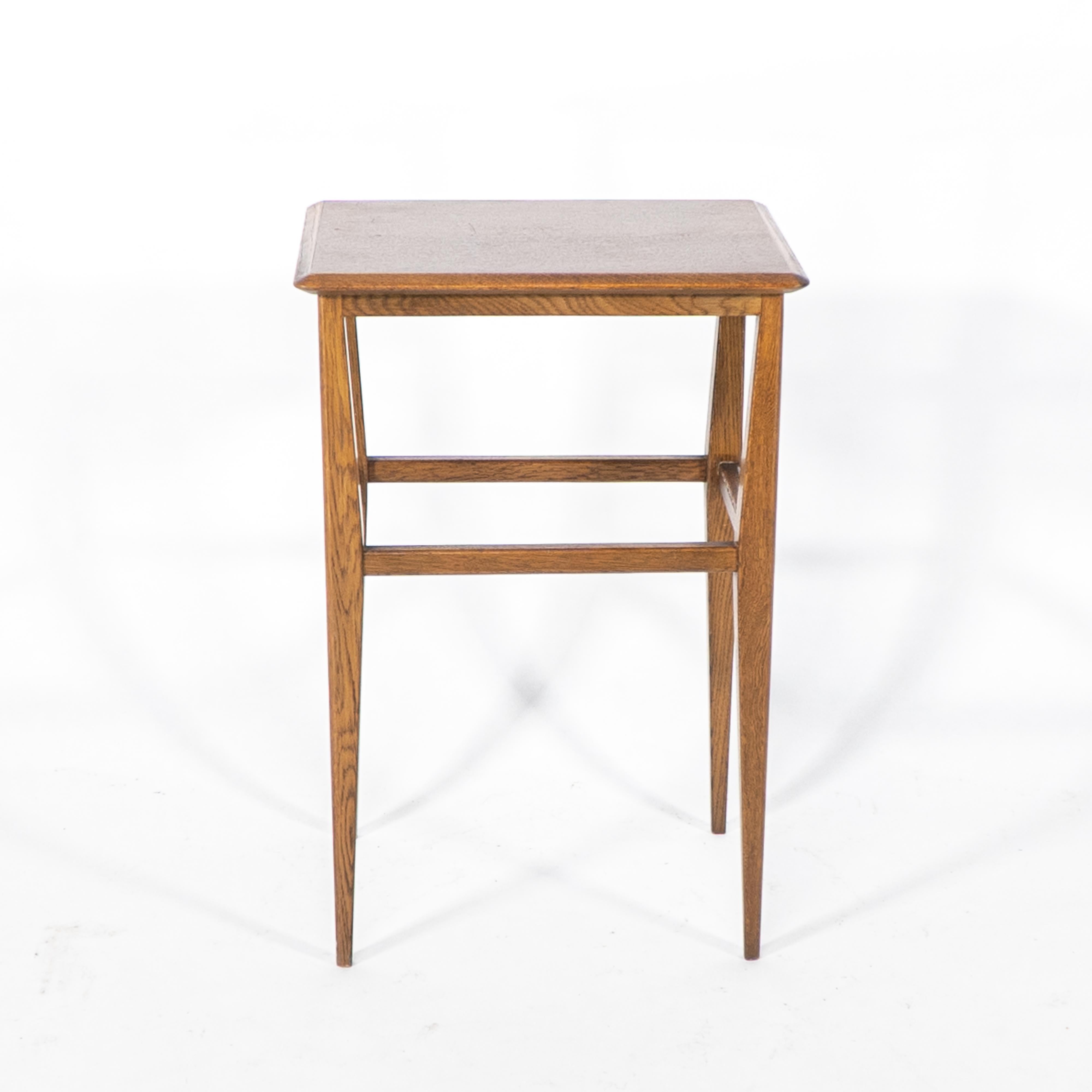 Early 20th Century An Arts & Crafts oak side table with molded edge to the top & shaped legs For Sale