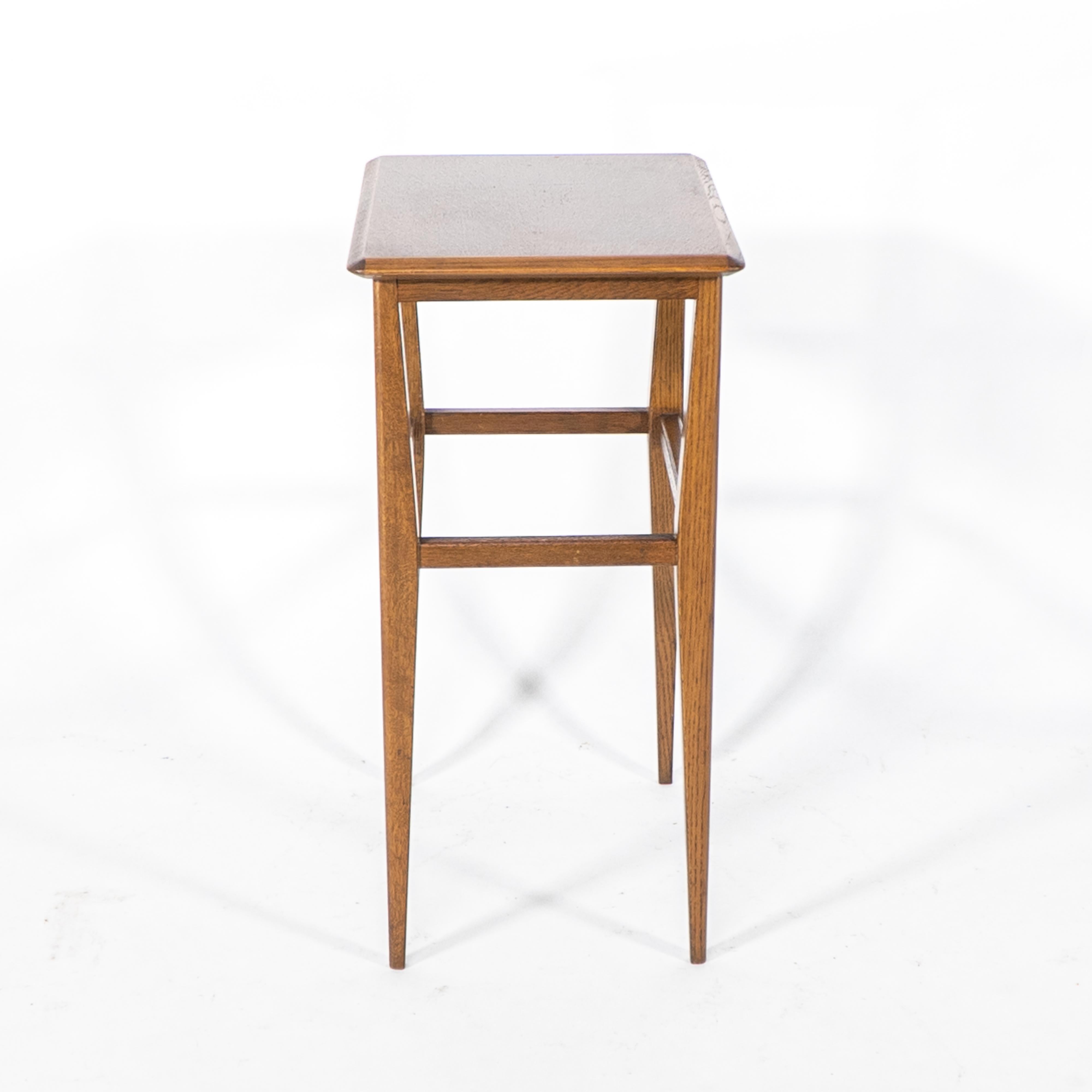 Oak An Arts & Crafts oak side table with molded edge to the top & shaped legs For Sale