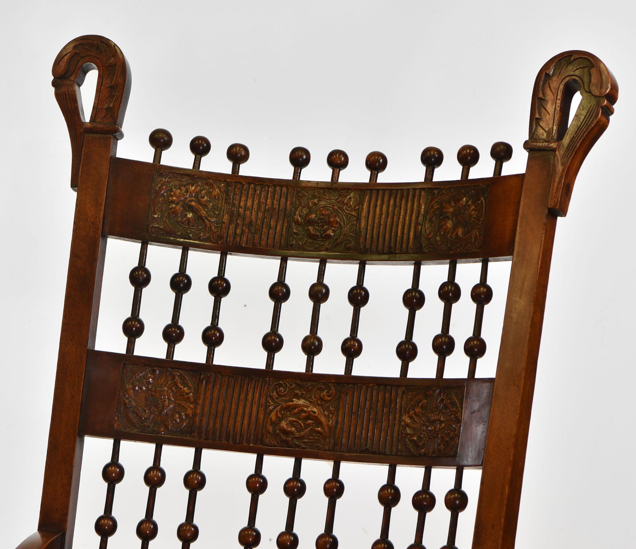 An Arts & Crafts rocking chair with embossed leather panels. Circa 1890.

With sinuous swan neck uprights, and bobbin turned detail in between stylised leather embossed panels.

The rocking chair has no loose joints, and it is very sturdy. The