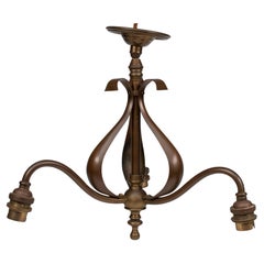 Antique An Arts & Crafts three branch brass ceiling light with stylized leaf detail