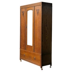 An ARTS & CRAFTS / ART NOUVEAU Wardrobe CABINET by HARRIS LEBUS, England 1900