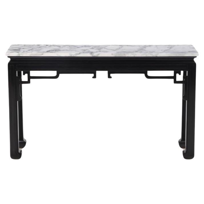 An Asian style marble top ebonized console table circa 1950.