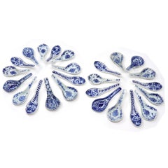 An assembled collection of 25 antique Chinese blue and white ceramic spoons.