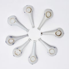 An assembled collection of 8 blue and white Chinese porcelain spoons.