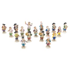 Used An Assembled Group of Seventeen Sitzendorf Porcelain Monkey Band Figures.