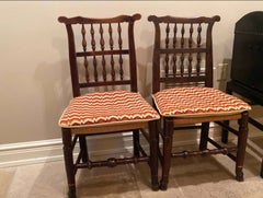 An assembled pair of George III Lancashire side chairs with ladder backs.