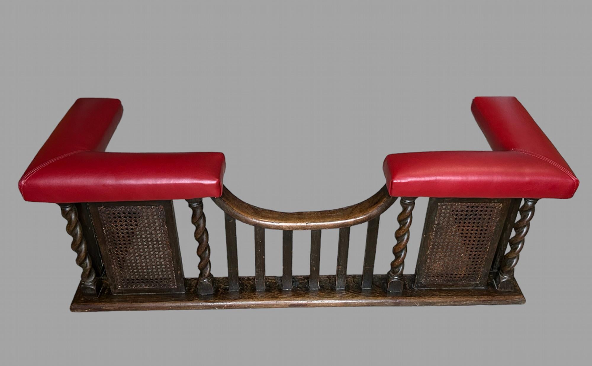 An Attractive Oak 19th Century Club Fender with new Alpha Romeo red leather top. The base with twisted rope and straight bars and two fittings of canned small partitions to the side with a shaped front. Internal measurement Width 109 cm and Depth