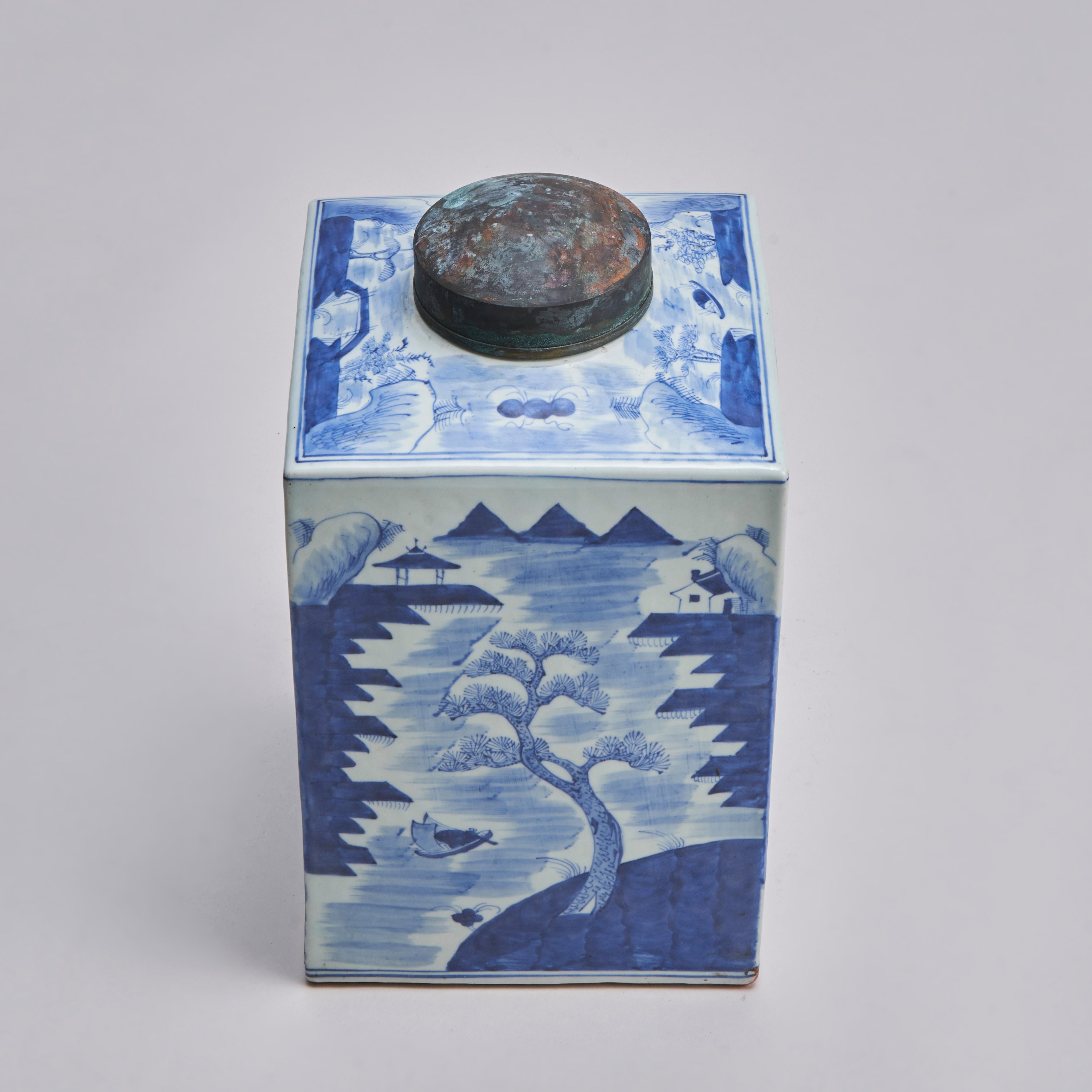 From our collection of antique Oriental ceramics, an early 19th century Chinese blue and white tea jar with a metal lid, decorated with the classic tea jar landscape design.

Contact us for further information or to arrange a viewing.