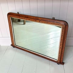 An attractive French Oak Art Nouveau Hall or Bistrot Mirror. The bevelled oval m