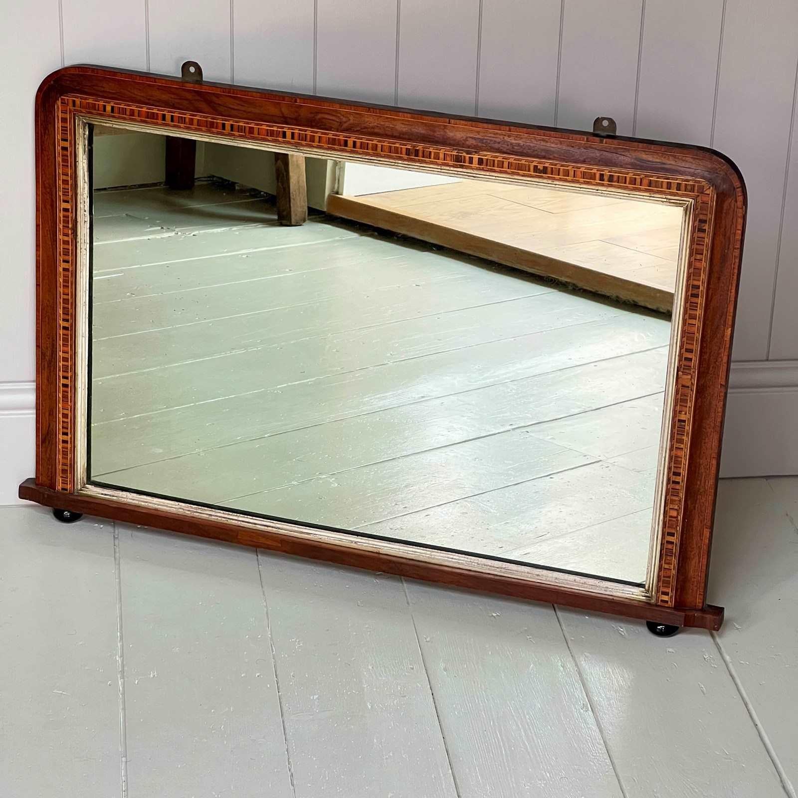 English An attractive French Oak Art Nouveau Hall or Bistrot Mirror. The bevelled oval m