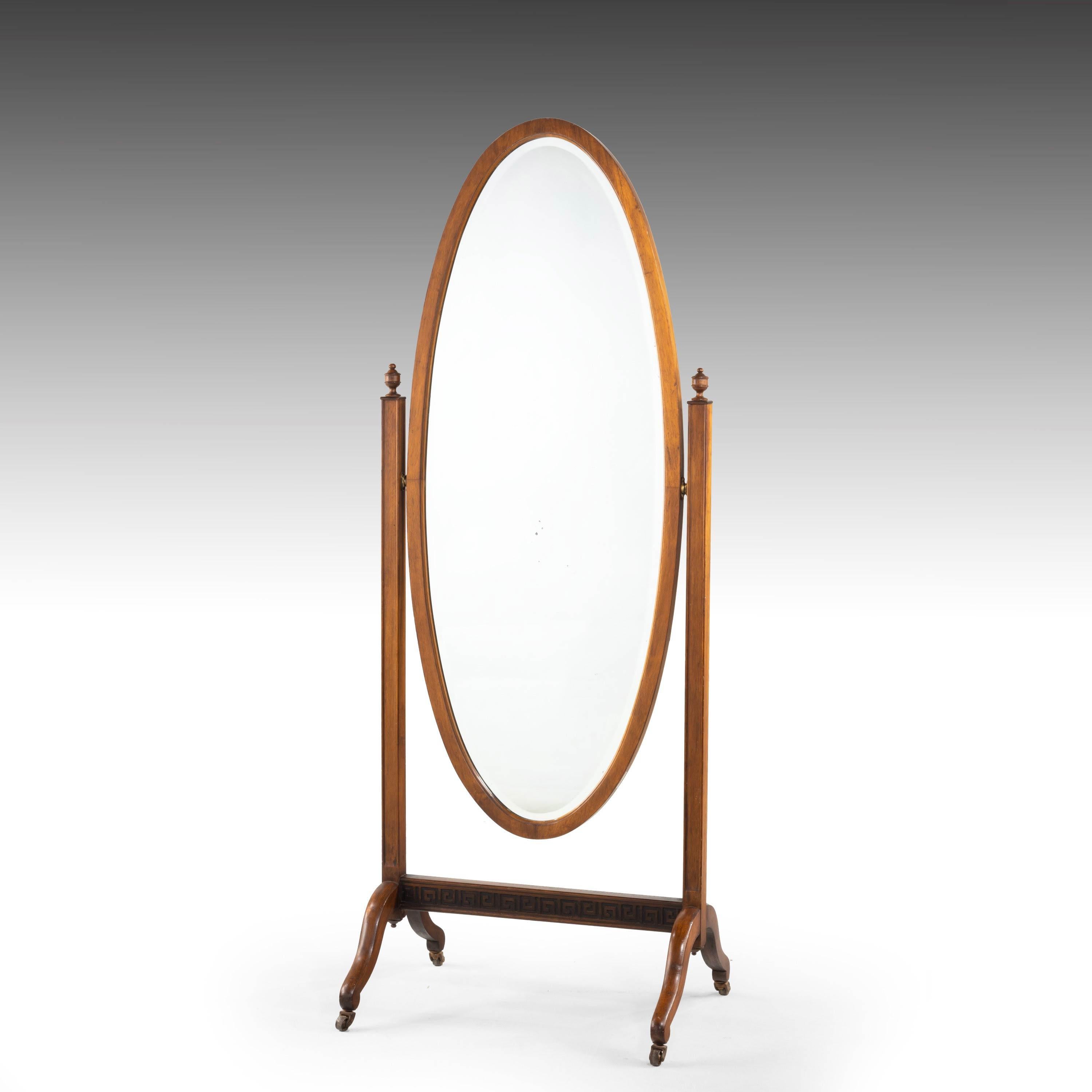 An attractive oval mahogany framed cheval mirror. On square section uprights and cabriole supports. Original bevelled plate glass. 
 
