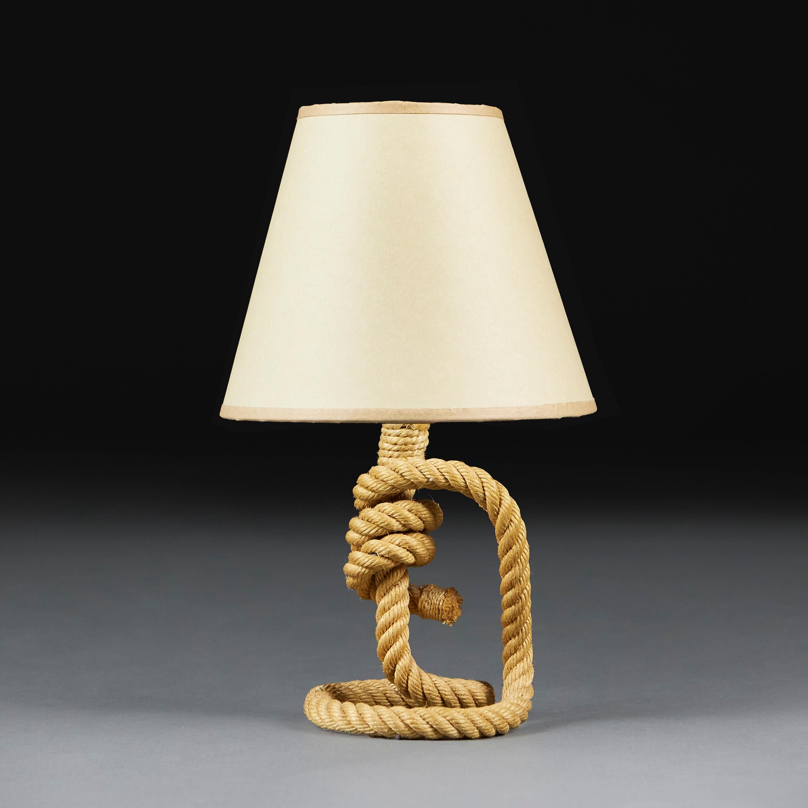 France, circa 1950
A rope twist lamp of small scale, in the manner of Audoux Minet, with knotted centre and looping arm to one side. 

Adrian Audoux and Frida Minet were a prolific French Modernist designer duo active in the 1940s and 50s. Their
