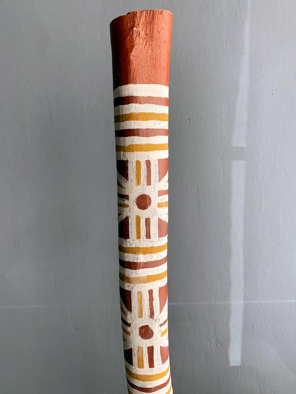 A hollow log painted with Ocher with a clan-based design.
Title: Djirrididi Log
Artist: James Patrick Lamuta
DOB: 01/04/1984
Medium: Ocher pigment on wood
Provenance: COA from Elcho Island Art Center of Galiwin'ku Community.