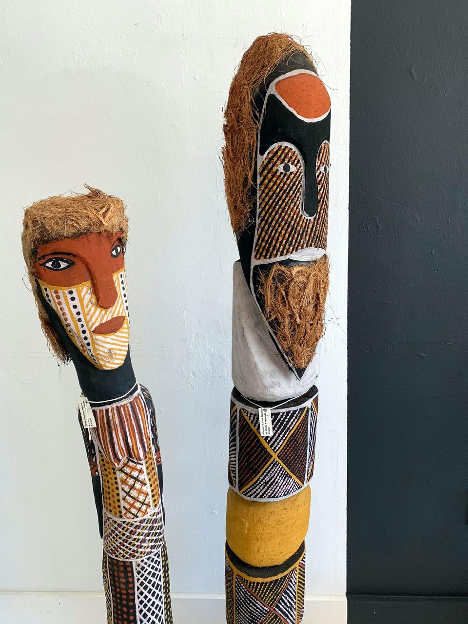 A pair of large carved statues that depict an ancestor couple from Tiwi Island, off the northern coast of Northern Territory. They were carved out of ironwood, a very dense wood native to the island. The body surface is covered with clan specific