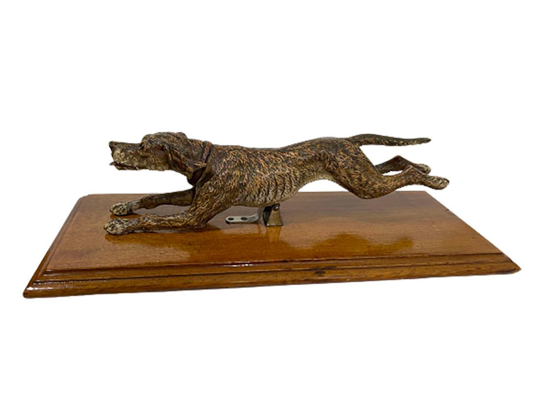 An Austrian bronze paper clip

A Viennese cold painted bronze dog figurine, designed as a paper clip mounted on a polished mahogany base. The bronze is not marked.
Austria, ca. 1900
The total measurement of the paperclip is 7 cm high, 32 cm wide