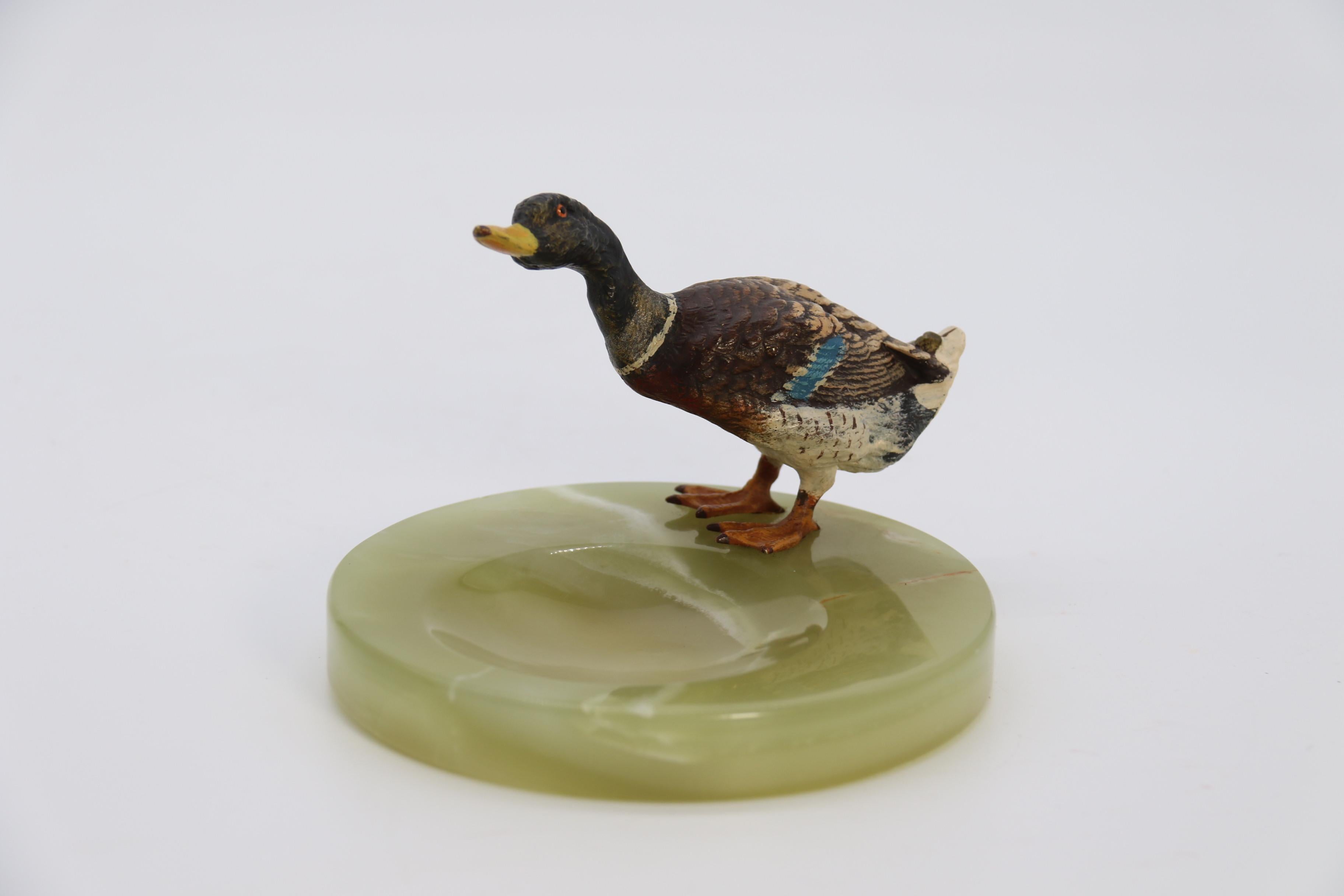 An Austrian cold painted bronze study of a drake mallard duck drinking

This fine bronze study of drake mallard duck was produced in Austria, circa 1930. It is very well modelled and finely hand painted it retains all of its original paint in rich