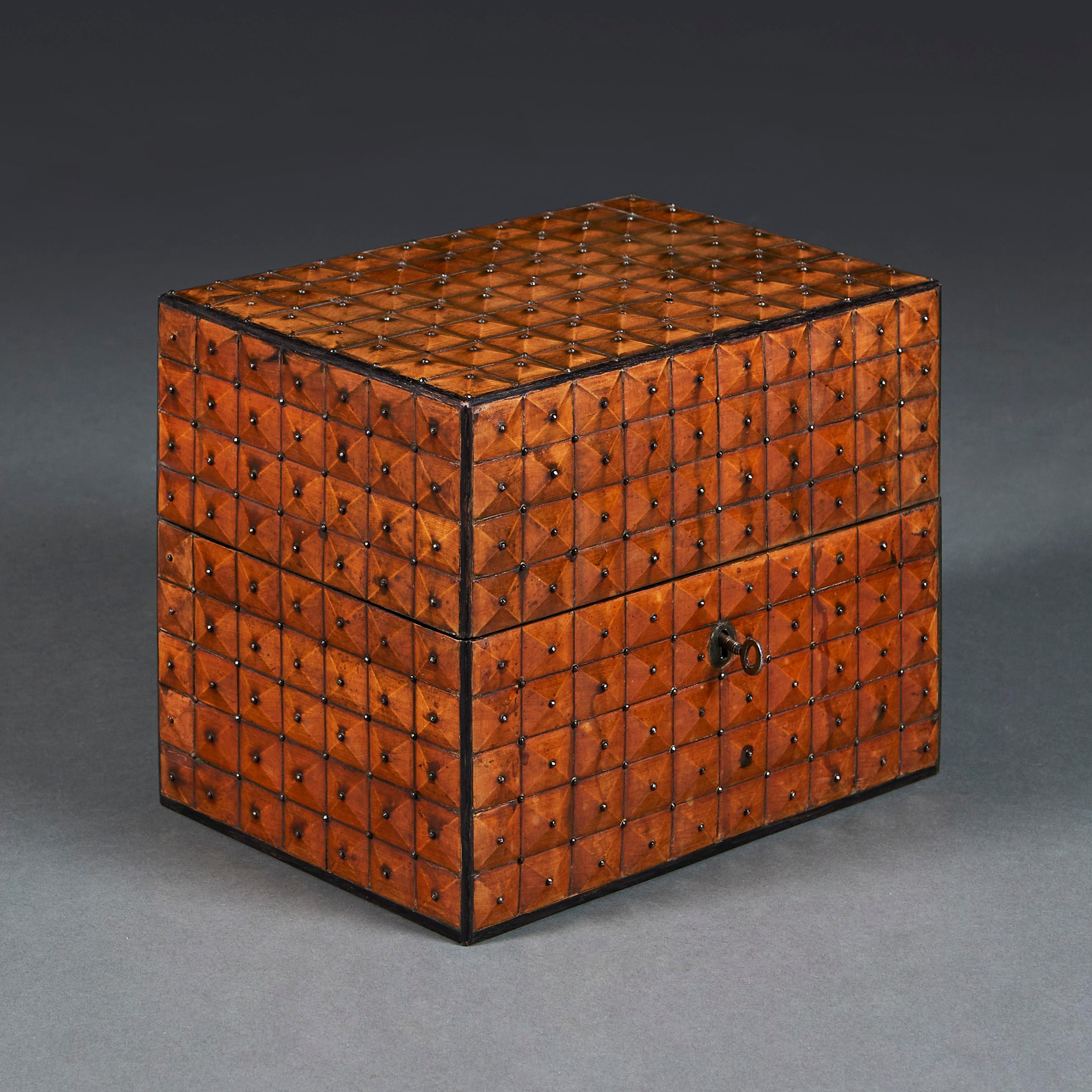 Austria, circa 1880

An unusual late nineteenth century Austrian fruitwood casket, with carved geometric pattern studded with iron pins, the interior lined with marbled paper.

Height 23.00cm
Width 28.50cm
Depth 19.50cm