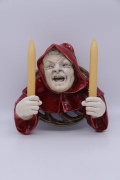 An Austrian pottery wall hanging candelabra in the form of a monk circa 1910