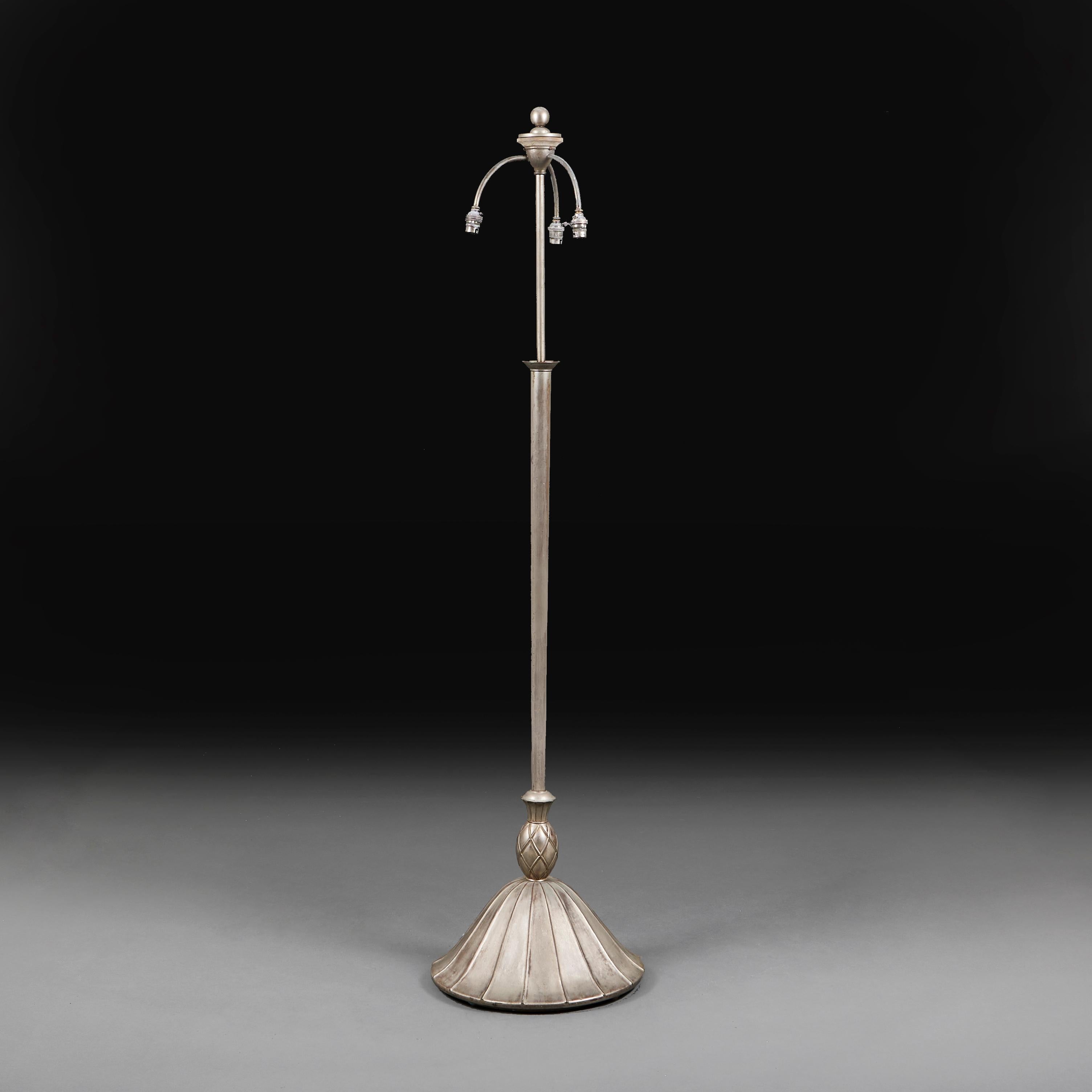 An unusual late nineteenth century pewter standard lamp with a flared and gadrooned base and a turned stem.

Please note:

Lampshade not included. Lamp photographed with a 24” diameter pale cream card Pembroke lampshade.

Currently wired for the UK