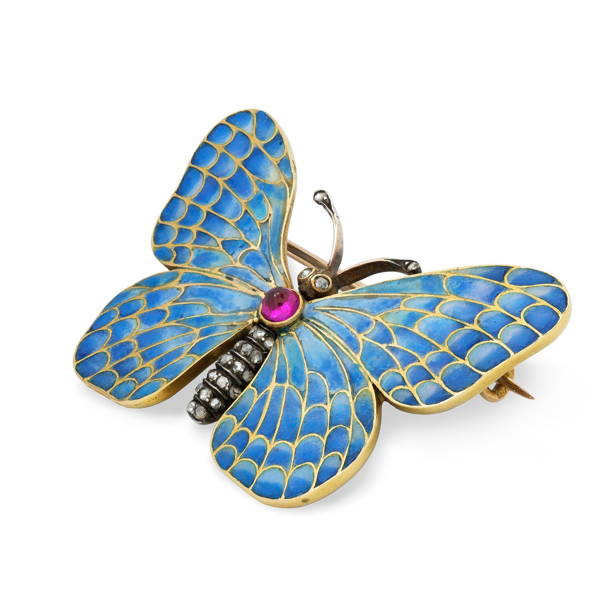 An Austro-Hungarian enamel, diamond and ruby butterfly brooch, the thorax bearing a round cabochon ruby, with rose-cut diamond encrusted abdomen, with blue plique-a-jour enamel wings, all mounted in silver and yellow gold, with gold brooch fitting,