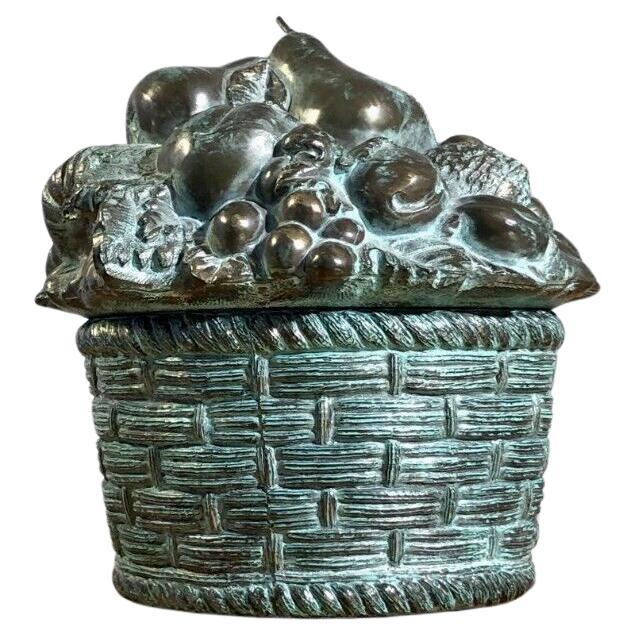 An authentic, opulent and very decorative ice bucket, patinated bronze fruit basket, base with woven basket decoration, lid with fruit composition, in superb patinated bronze (dark bronze with zones gold and cyan oxidized patinas), waterproof white