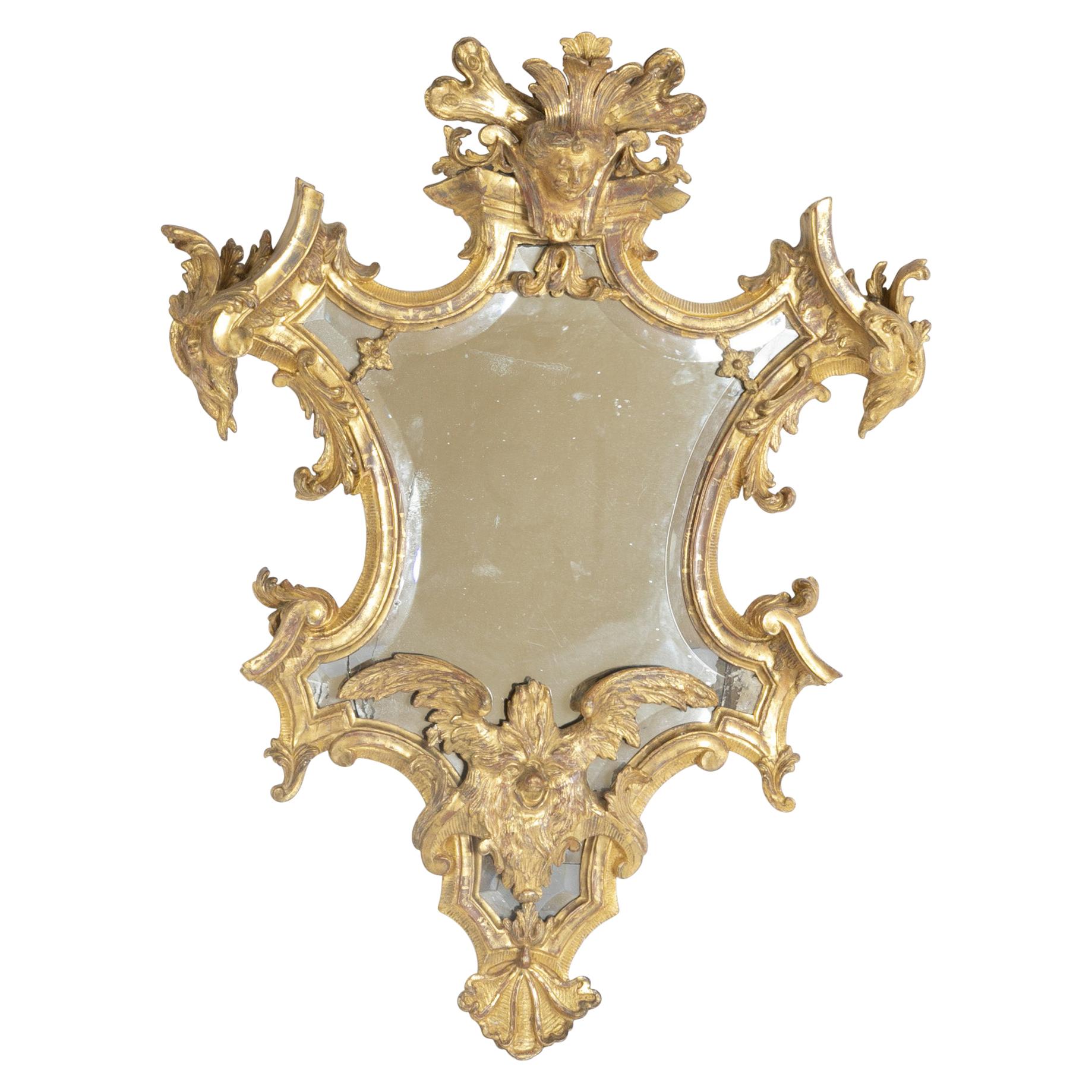 Baroque Italian Mid-18th Century Gilt Mirror with Faces