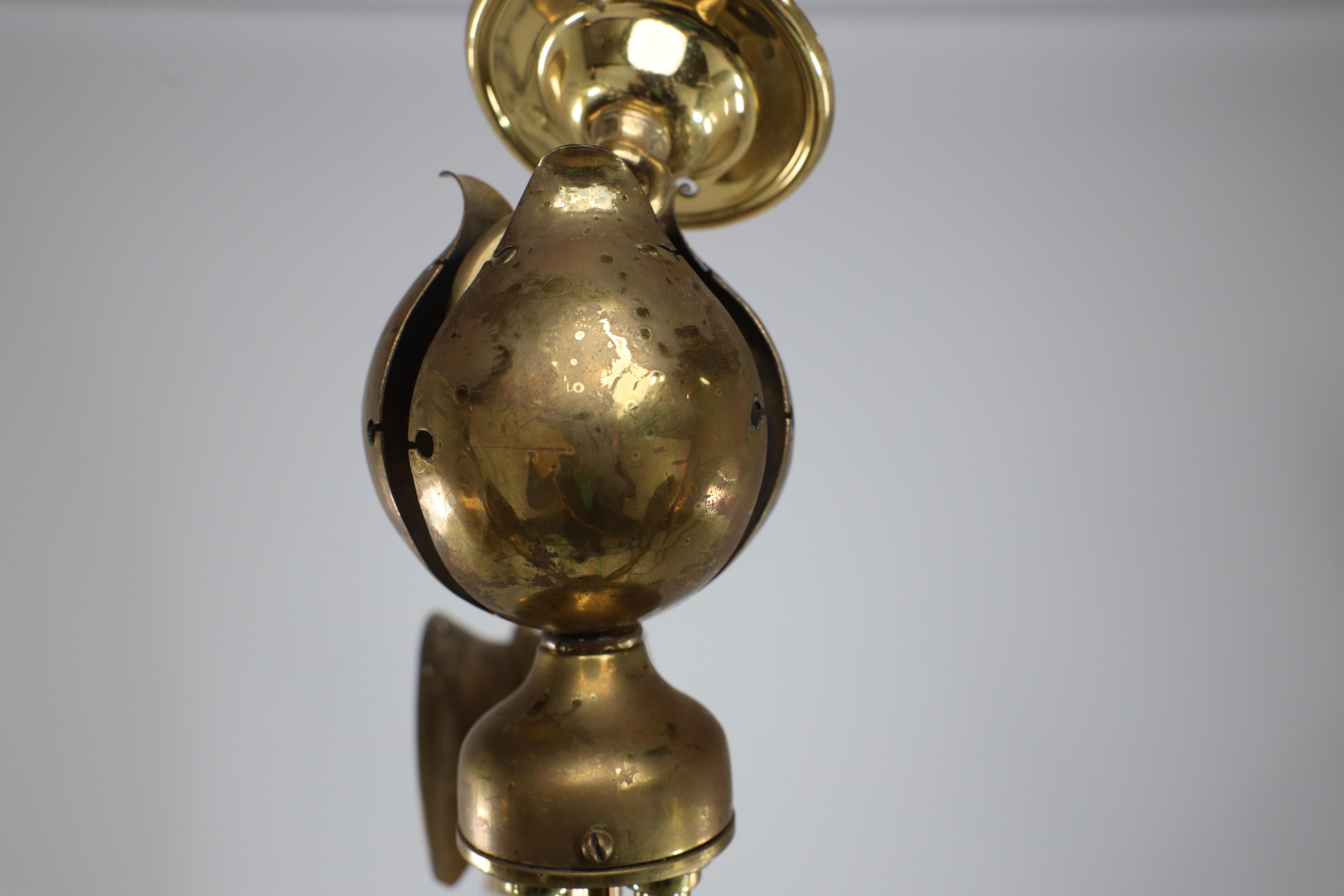 A brass three arm ceiling light with a central shaped sphere & leaf decoration In Good Condition For Sale In London, GB
