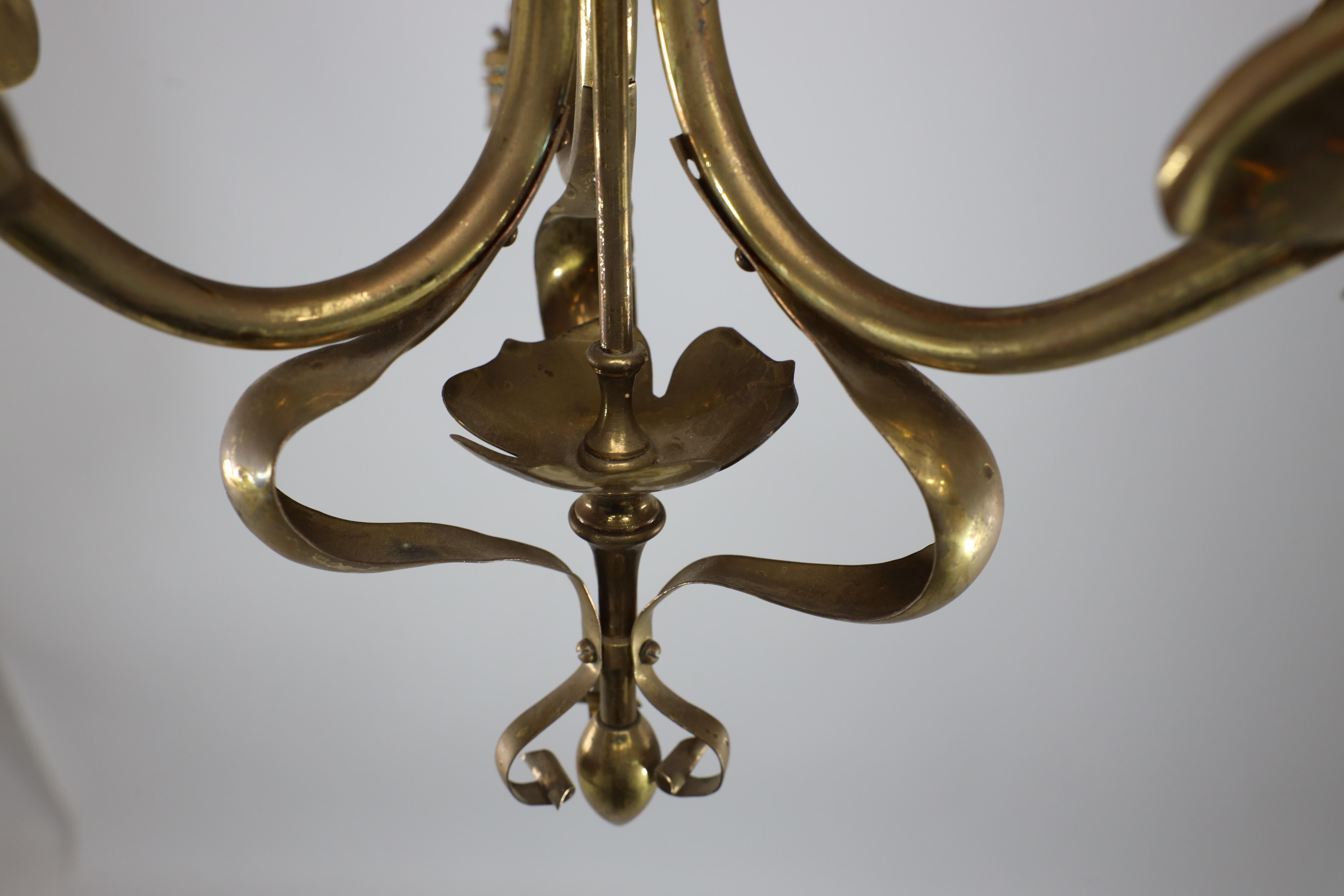 A brass three arm ceiling light with a central shaped sphere & leaf decoration For Sale 2