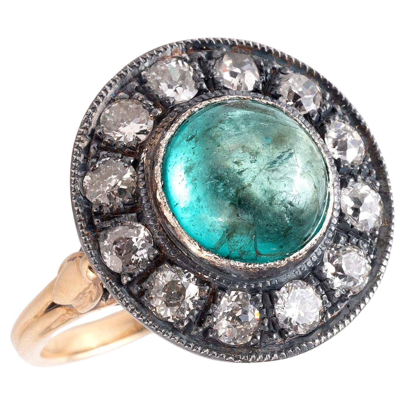 An Cabochon Emerald And Old Cut Diamond Cluster Ring