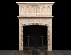 An early 17th century English Jacobean period Bath-stone mantel