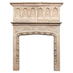 An early 17th century English Jacobean period Bath-stone mantel