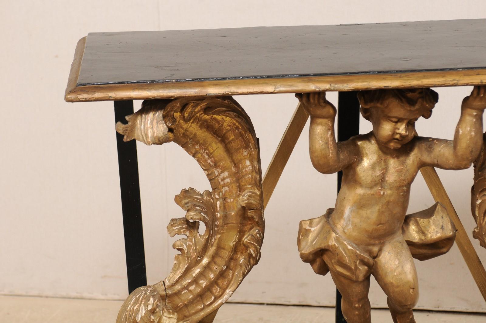 Table console rococo italienne du début du 18e siècle avec un putto magnifiquement sculpté Bon état - En vente à Atlanta, GA