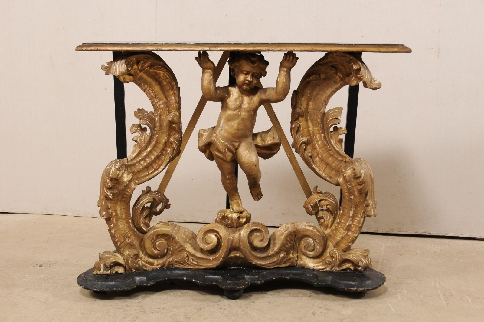 XVIIIe siècle Table console rococo italienne du début du 18e siècle avec un putto magnifiquement sculpté en vente