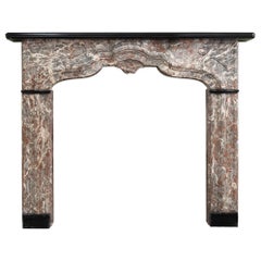 An Early 18th Century French Rance Marble Fireplace
