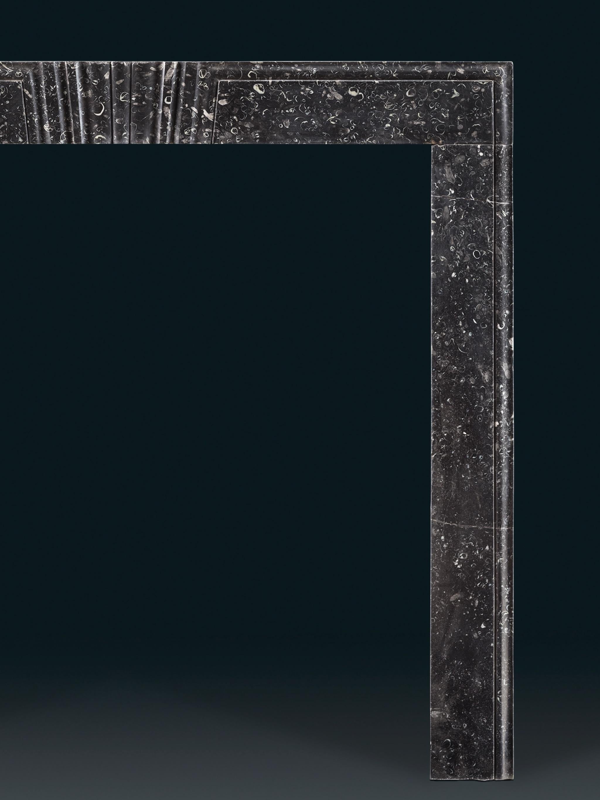 An early 18th century Irish frame chimneypiece in Kilkenny
fossil marble. The header carved with a central stylised
keystone.

Dimensions
Height 47½in (121cm) width 52in (132cm)
Internal height 42in (107cm) width 41½in (105cm)