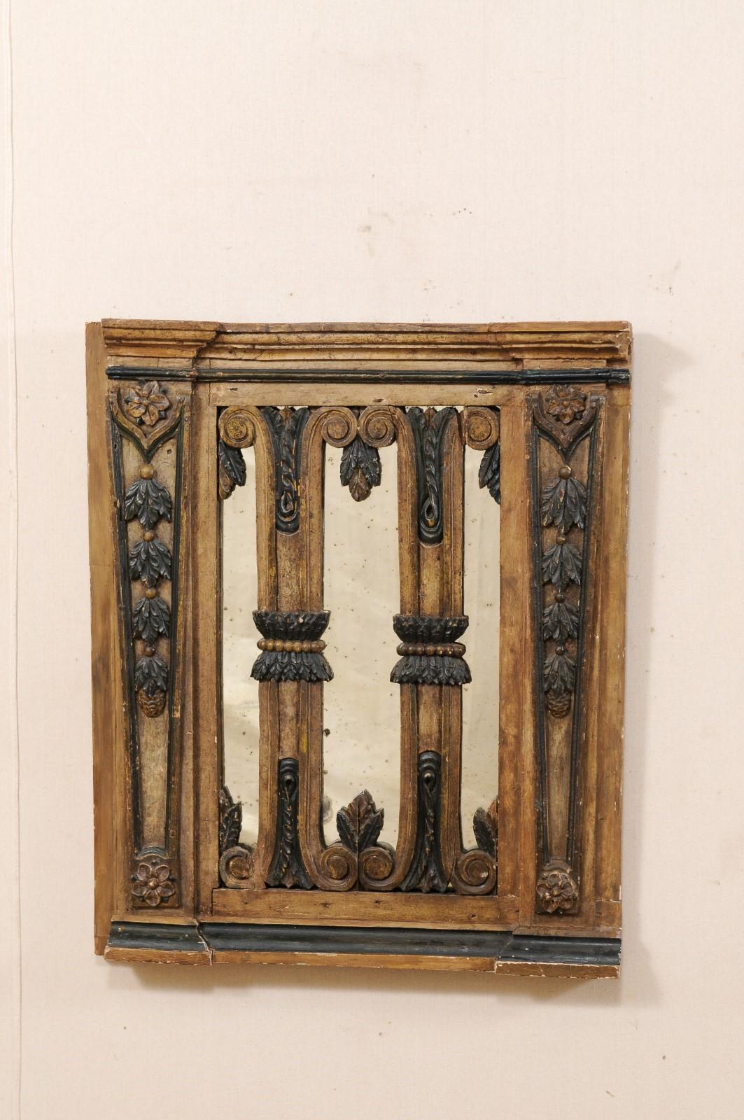 A one of a kind custom fashioned mirror which has been made from an early 19th century Portuguese gate. This antique wooden gate from Portugal acts as the frame from this custom designed mirror. The gate is craved with a floral and volute motif,