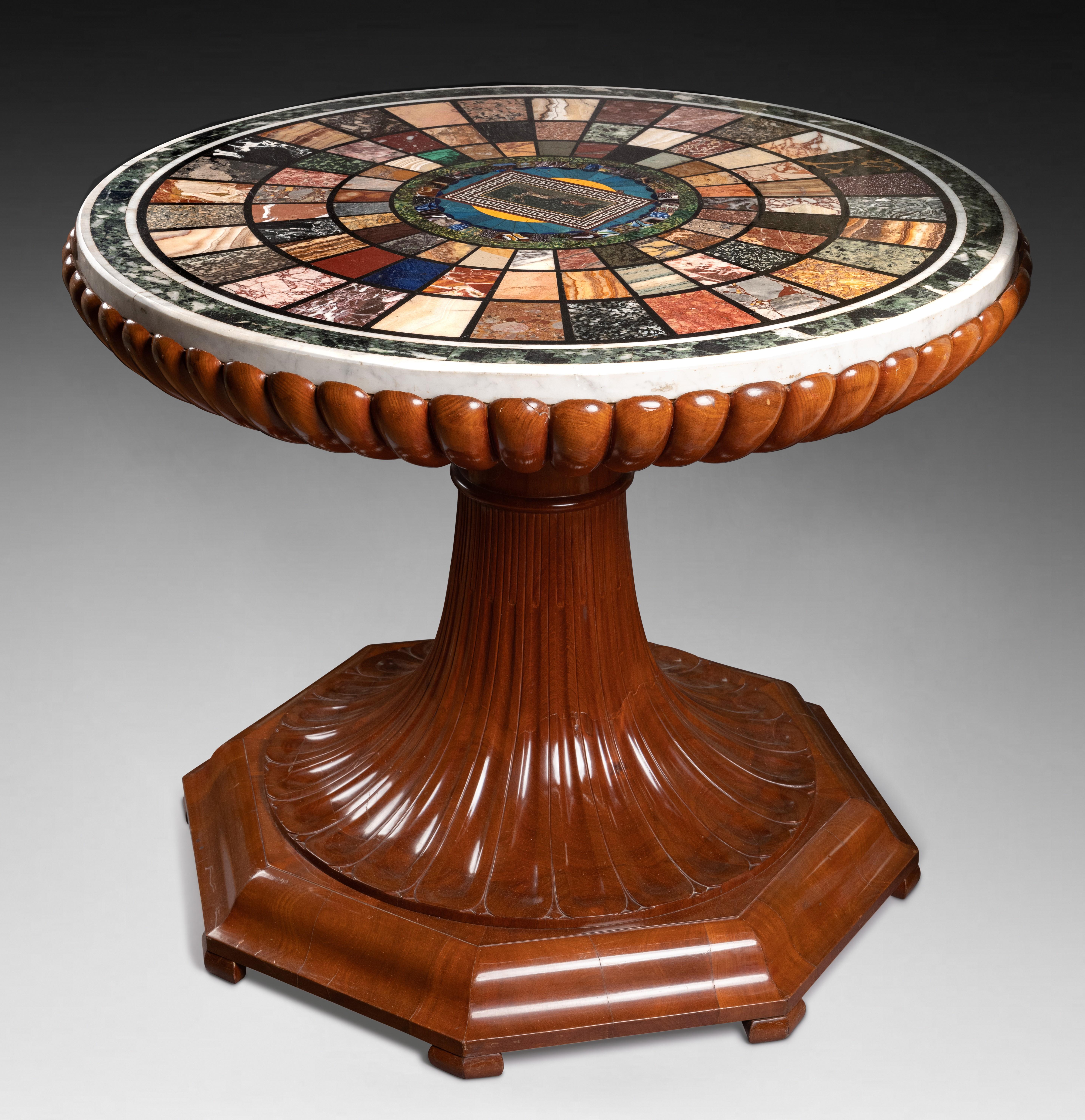 Richly carved fruitwood gueridon supporting an important white marble top inset with various marbles, hard stones, with Roman polychrome antique glass and Roman micro-mosaic
Rome, Italy, first third of the 19th century
Probably by Francesco
