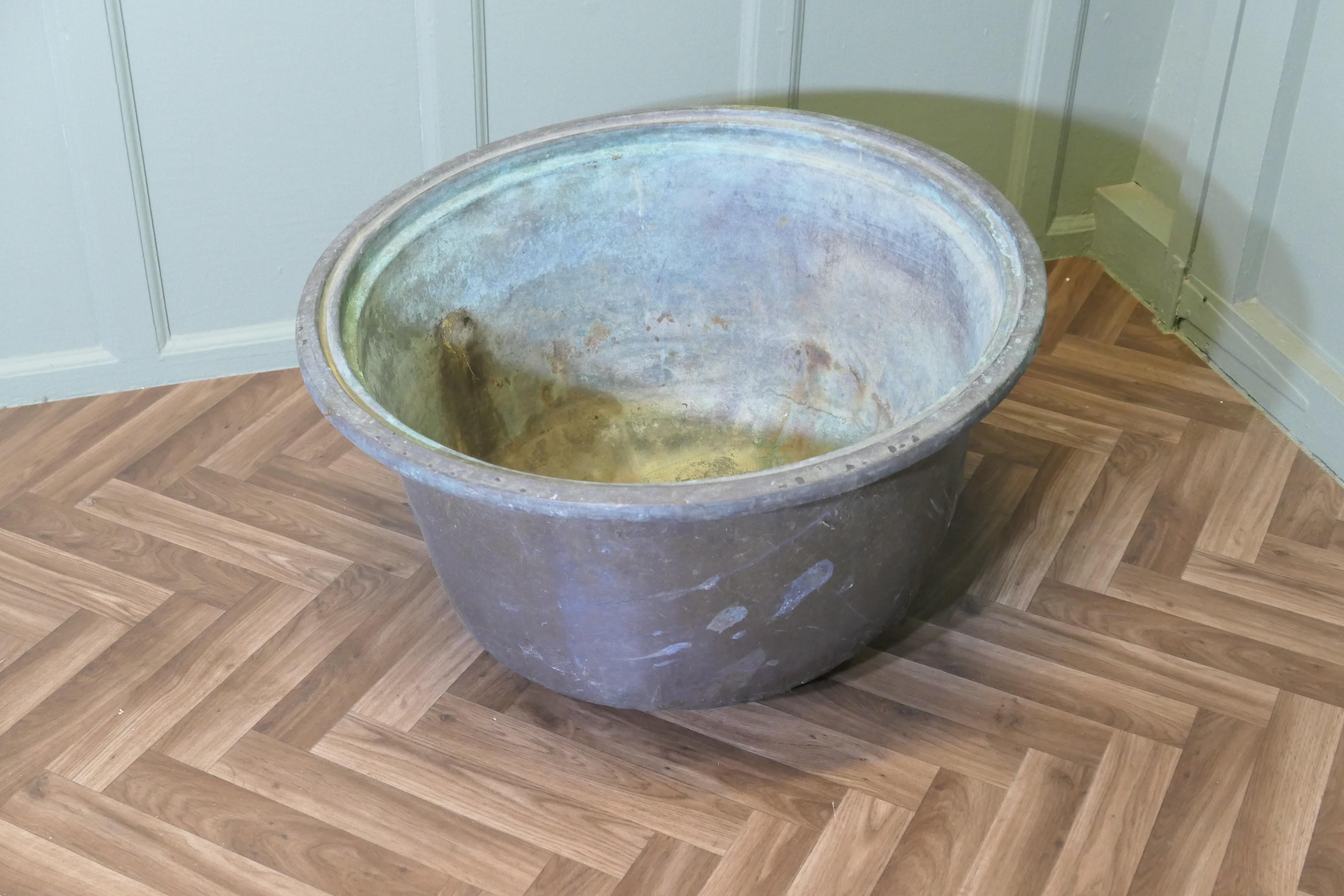 An Early 19th Century Antique Copper Cauldron

An Early 19th Century Antique Copper, a robust piece with with a drain hole at the bottom, once used to heat the water and would make an excellent Log Bin or Planter
Great surface patination and