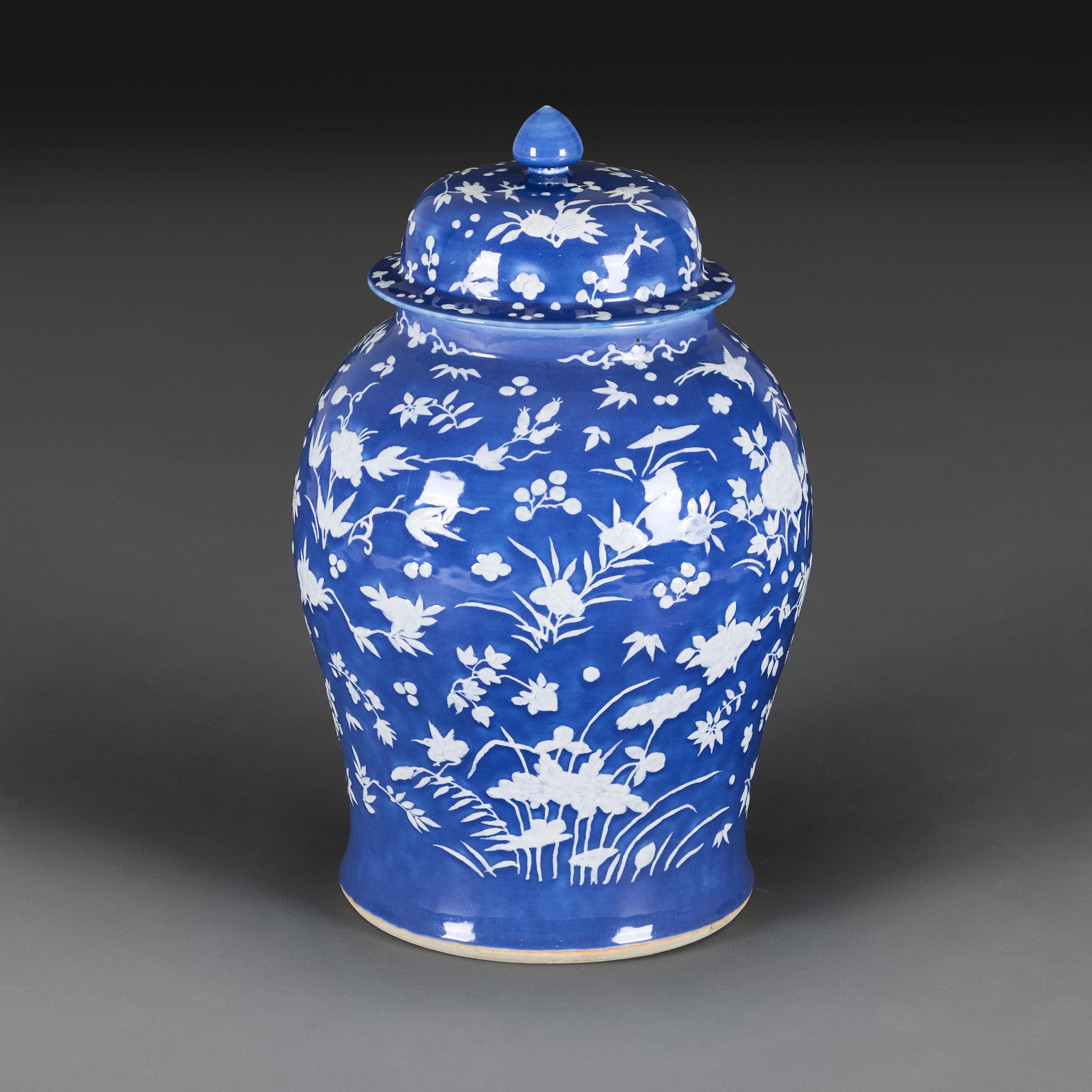 China, circa 1820

An early nineteenth century Chinese porcelain Canton temple jar of large scale, decorated with white bas-relief work of prunus blossoms and conjugal song birds on a blue ground, with a single historic restoration.

Height
