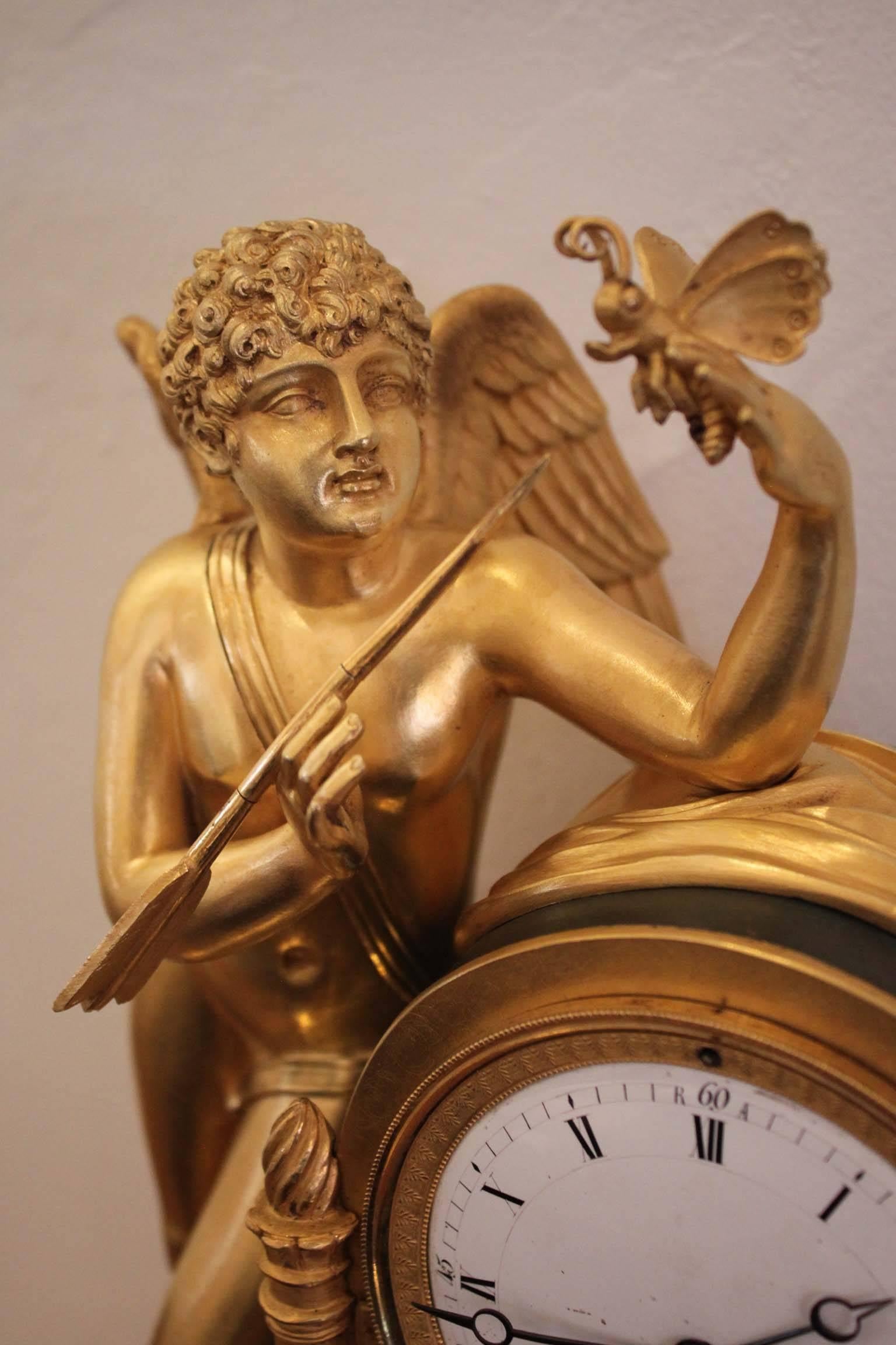 An Early 19th Century Cupidon Gilt Bronze Clock 1