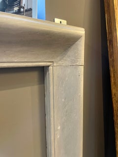 An Early 19th Century Dove Grey Marble Bolection Fireplace Mantel