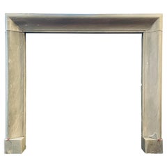 An Early 19th Century Dove Grey Marble Bolection Fireplace Mantel