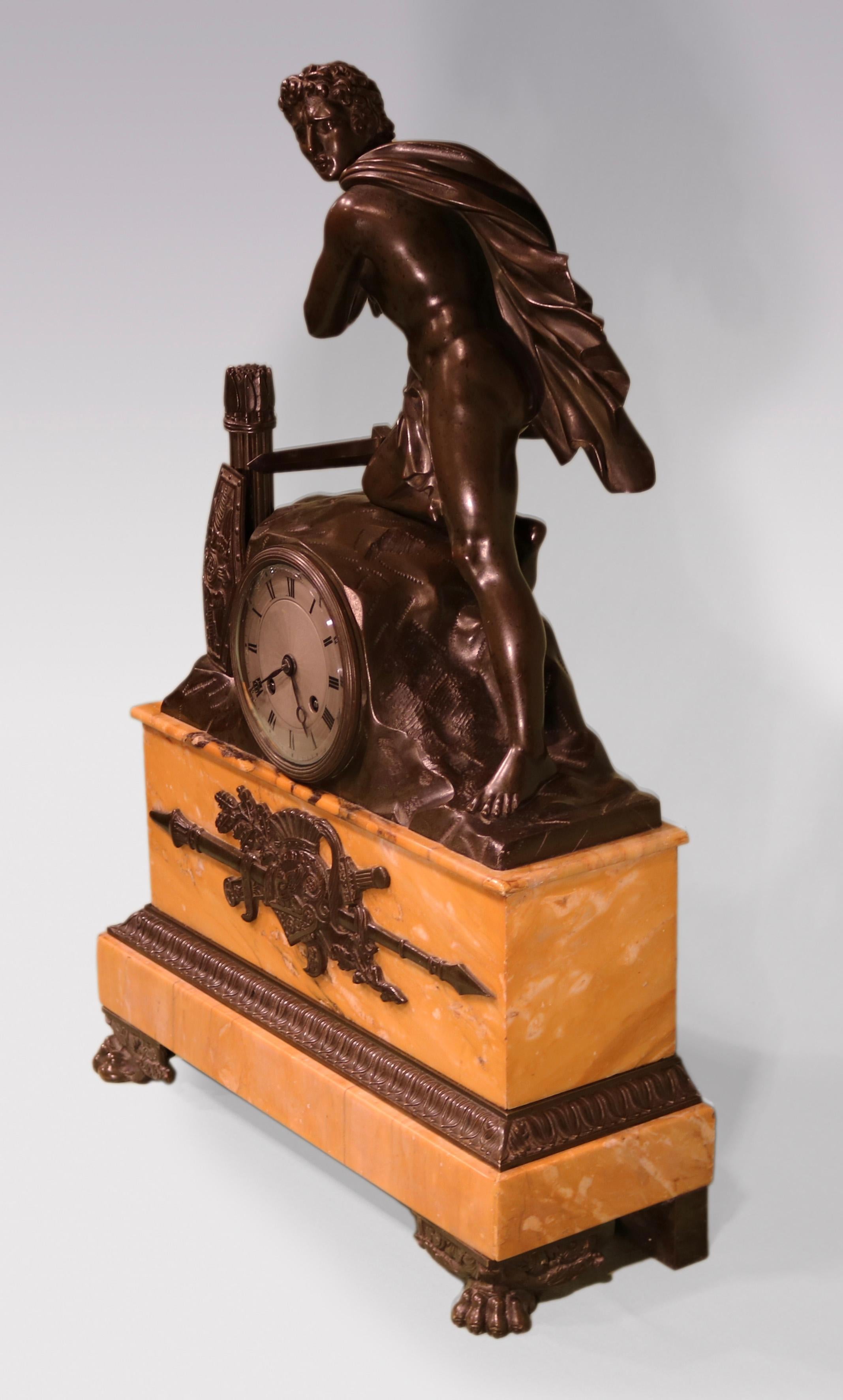 Régence An early 19th century French bronze and marble mantel clock For Sale