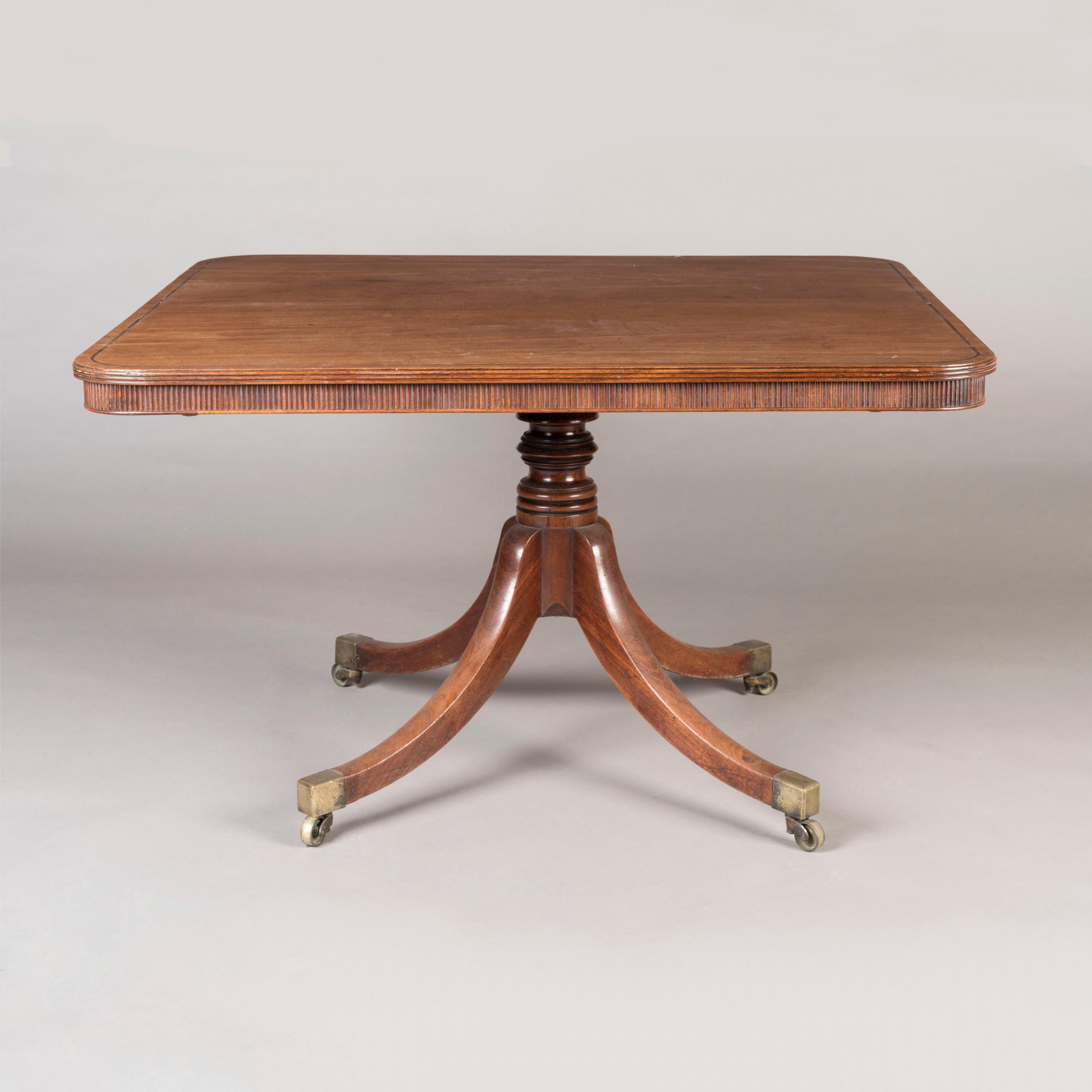 English An Early 19th Century George III Period Mahogany Table on Brass Castors For Sale