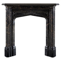 Antique An Early 19th Century Gothic Revival Mantle in Portoro and Belgium Black Marble
