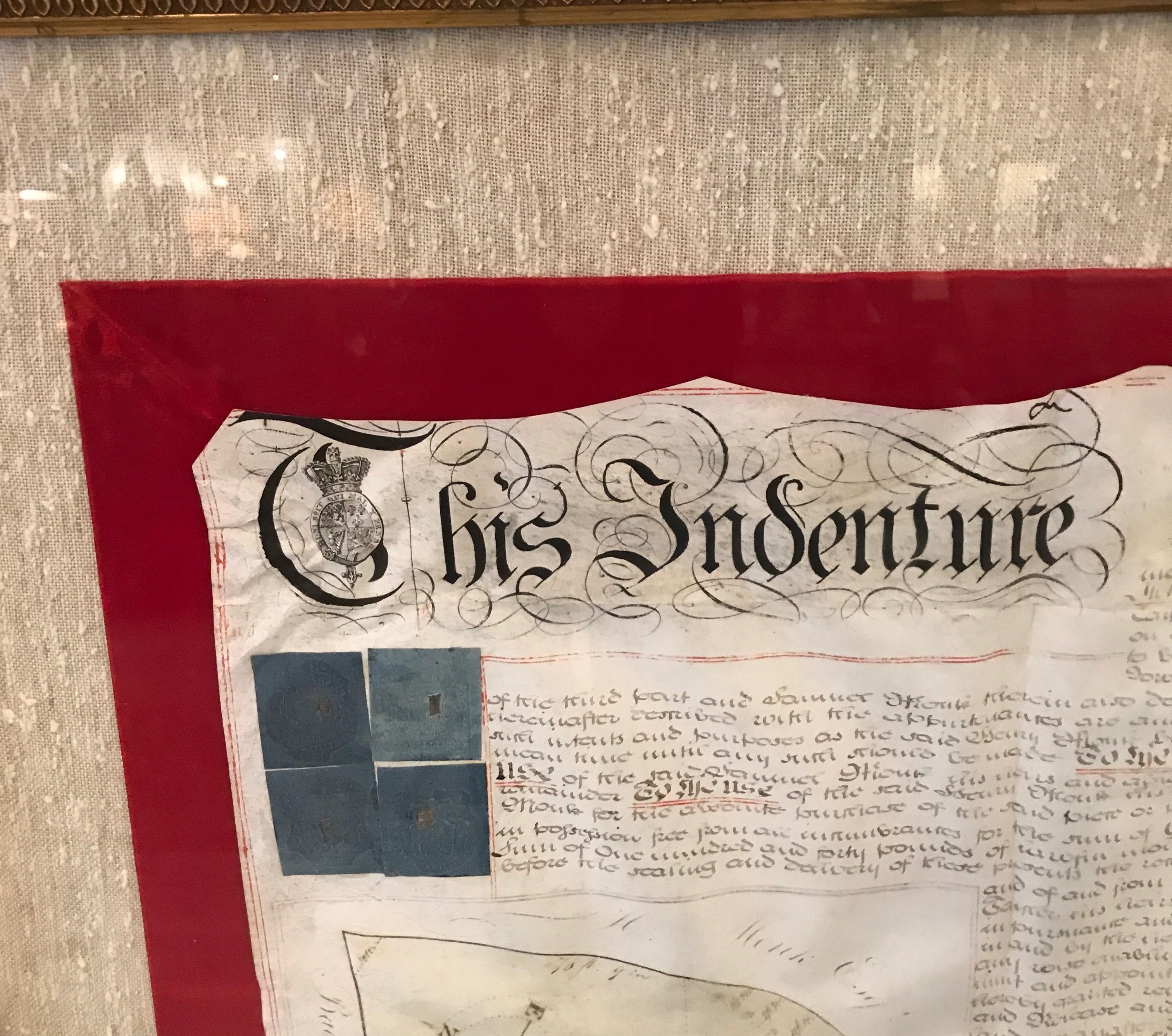 A large hand written land indenture document England, 1810, framed. The beautifully hand written document mounted on board with a red velvet border and handwoven silk mat. The document written in lengthy detail with the map of the parcel included on