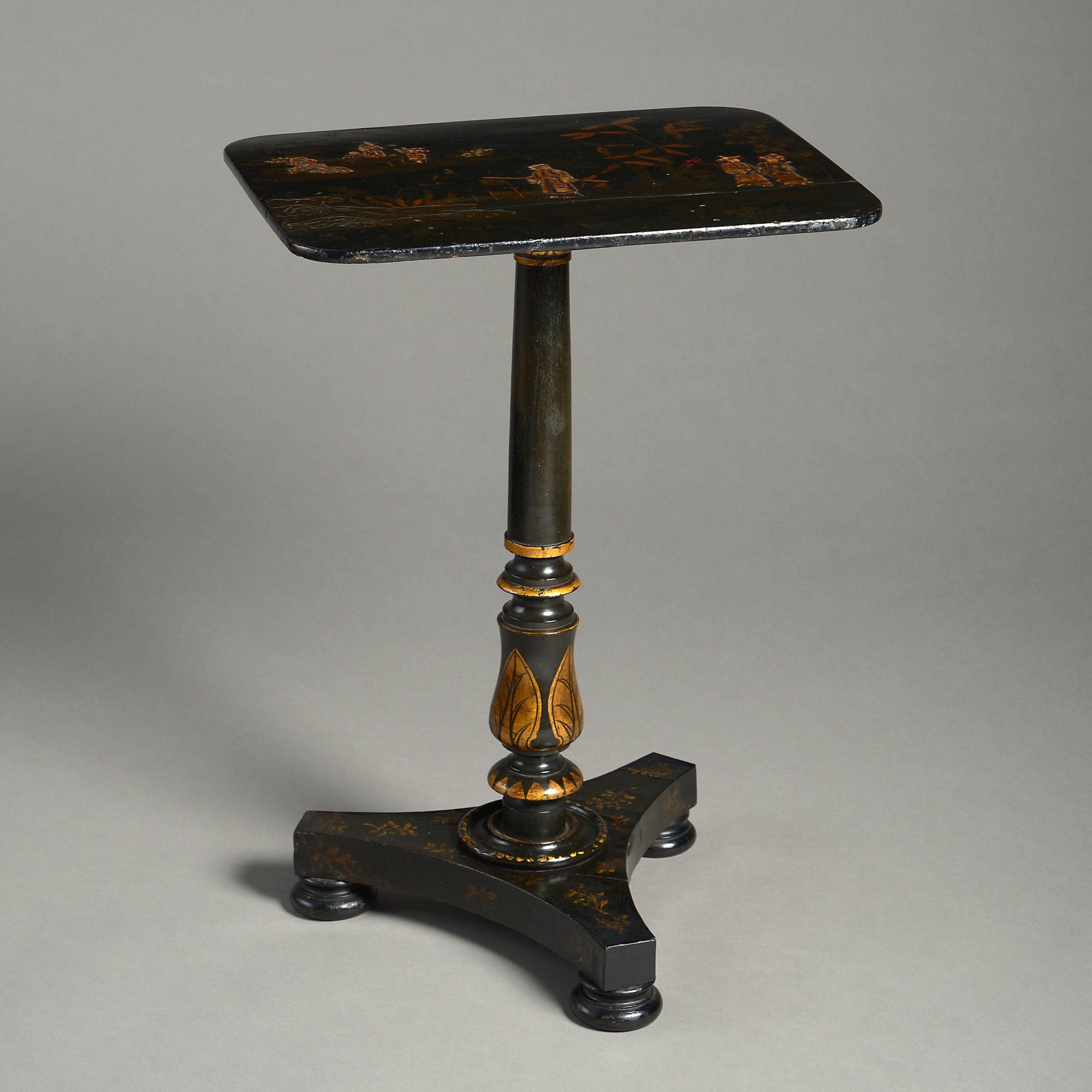 An early 19th century japanned occasional table, having a rectangular top decorated with chinoiseries, the turned stem and triform plinth base with gilded decoration.